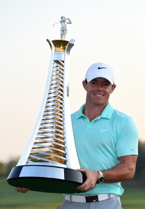DUBAI, UNITED ARAB EMIRATES - NOVEMBER 23:  Rory McIlroy of Northern Ireland with the Race to Dubai trophy after the final round of the DP World Tour Championship at Jumeirah Golf Estates on November 23, 2014 in Dubai, United Arab Emirates.  (Photo by Ross Kinnaird/Getty Images)