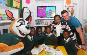 PORT ELIZABETH, SOUTH AFRICA - JUNE 22: Mascott Bokkie, Lwazi Mvovo, and Jesse Kriel pose with Walmer Primary School Principal Ms Zuki Maku and students during the Boks for Books Opening of Mobile School Library at Walmer Primary School on June 22, 2016 in Port Elizabeth, South Africa. (Photo by Richard Huggard/Gallo Images)