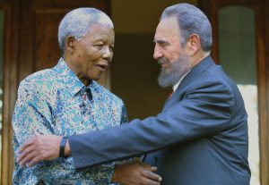 Former South African president Nelson Mandela (L) hug with Cuban president Fidel Castro at Mandela's office in Johannesburg 02 September 2001. Castro who took part in the UN World Racism conference in Durban used the opportunity to visit Mandela, whose health is effected by cancer.